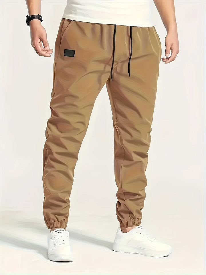 Herren Technische Jogginghose im Tapered‑Utility‑Stil mit elastischem Bund & Knöchelbündchen Drune