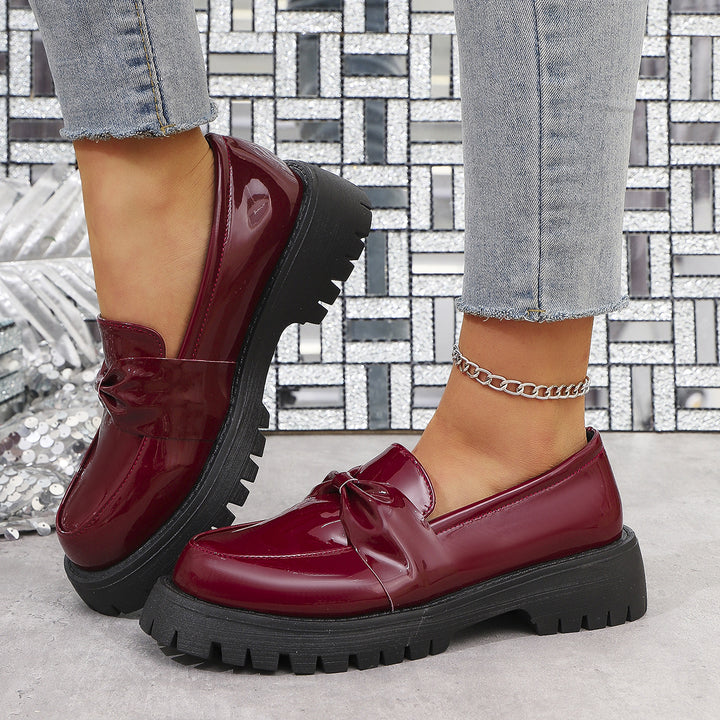 Damen  glänzende Plateau-Loafer mit übergroßer Schleifenapplikation und profilierter Gummisohle Drune