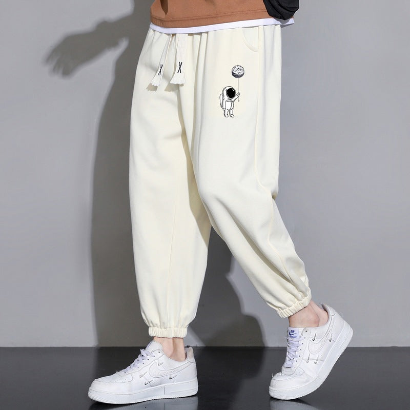 Herren Lockere Jogginghose mit Astronauten-Print, Kordelzugbund und elastischen Saumbündchen Drune