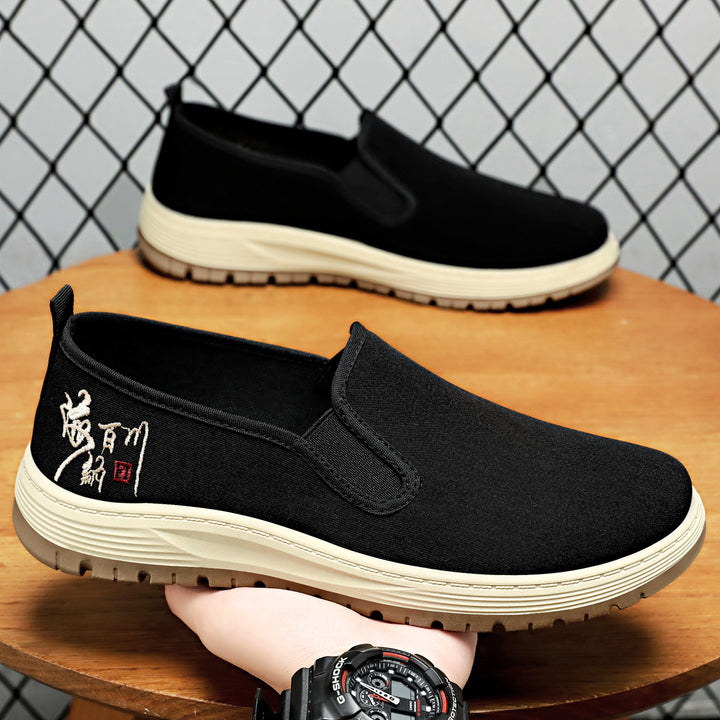 Herren nan nahtloser Canvas-Slip-On mit elastischem Einstieg, besticktem Fersenmotiv und rutschfester EVA-Laufsohle Drune