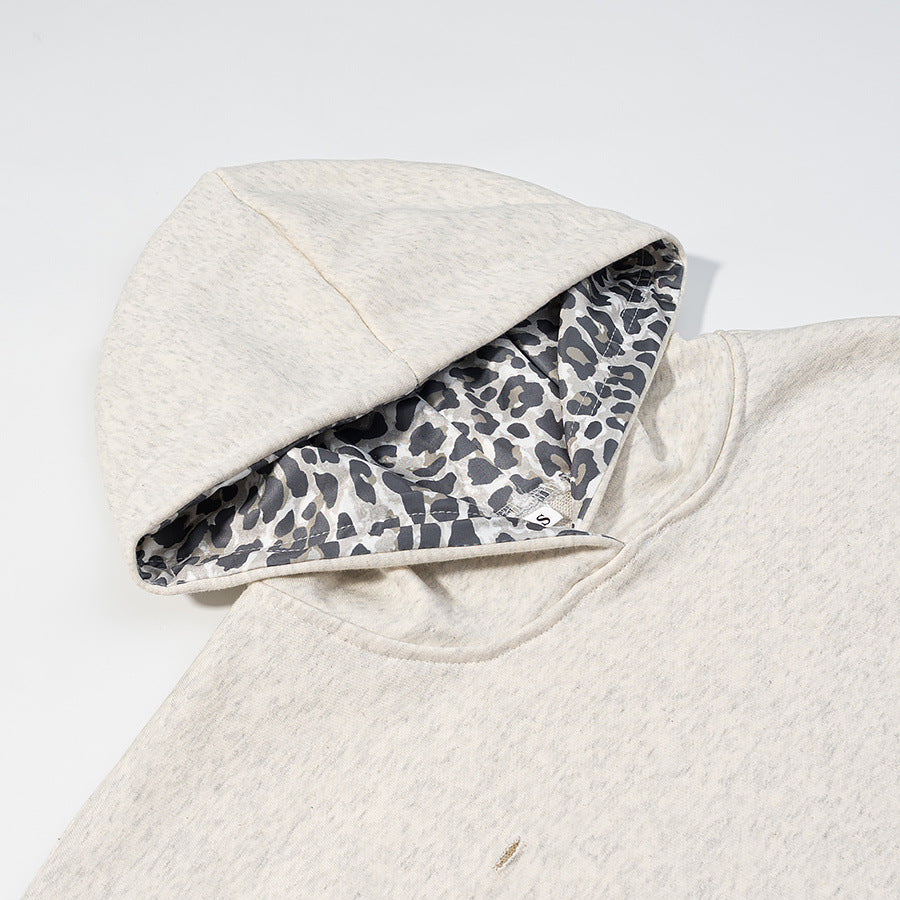 Damen nan weites Kapuzen‑Sweatshirt mit Leomuster‑Futter, Kängurutasche und Vintage‑Effekt Drune