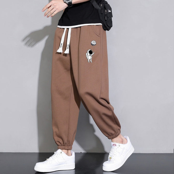 Herren Lockere Jogginghose mit Astronauten-Print, Kordelzugbund und elastischen Saumbündchen Drune