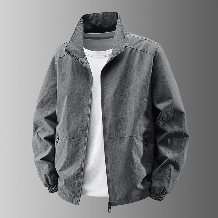 Herren nan atmungsaktive leichte Windjacke mit Stehkragen, elastischen Bündchen und verdeckten Reißverschlusstaschen Drune