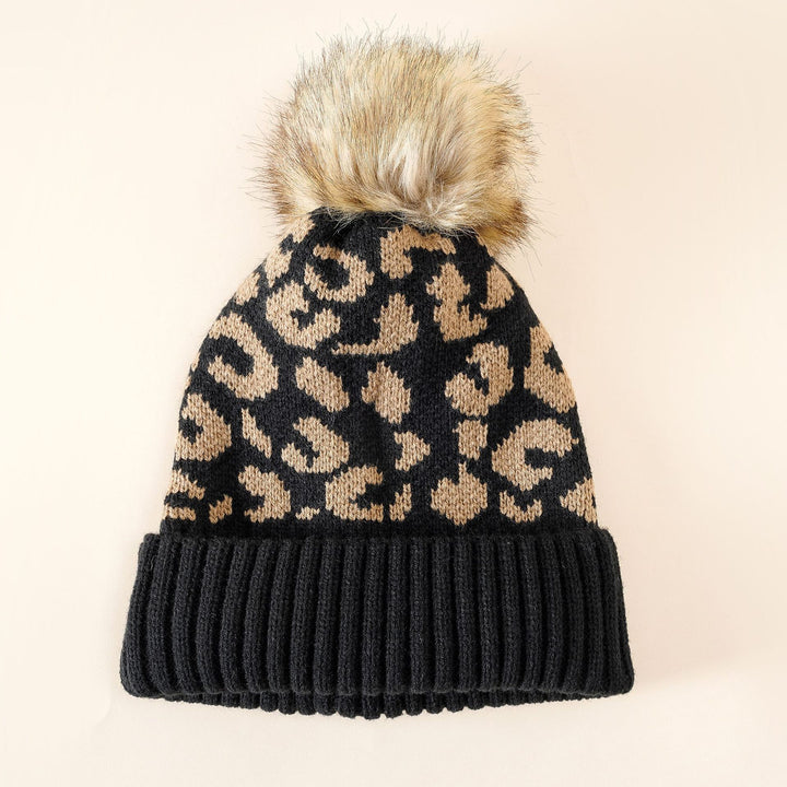 Damen Strickmütze mit elegantem Leopardenmuster und kuscheligem Kunstfellpompon Drune