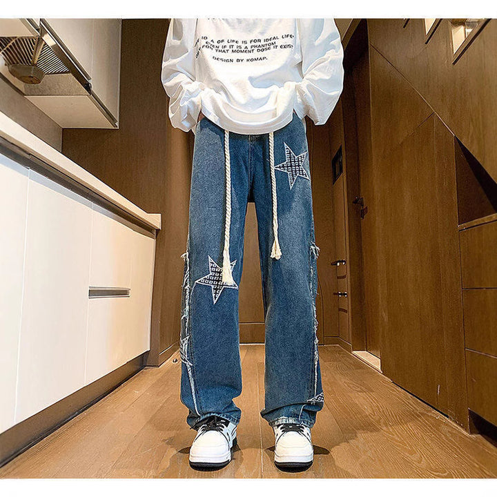 Damen Weite High‑Waist Denimhose mit Stern‑Applikationen, Fransen‑Seitenschlitzen und Kordelbund Drune