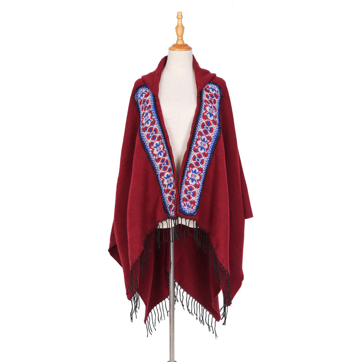 Damen Kapuzenponcho aus Wollmix mit kontrastreicher Blumenstickerei und Fransensaum Drune