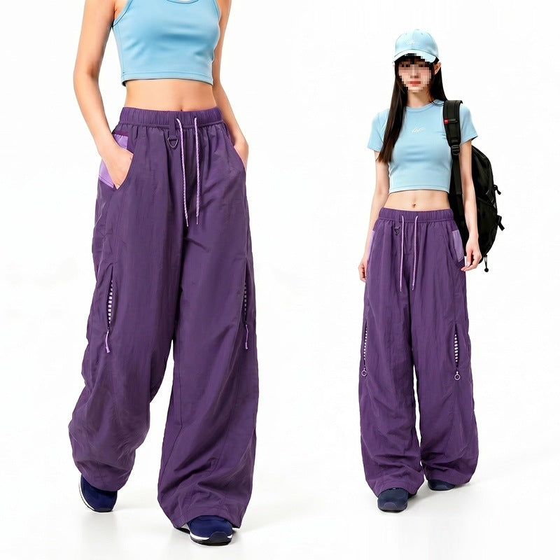 Damen Oversize Tech-Loungehose mit Kontrastnähten, reflektierenden Reißverschlusstaschen & Kordelbund Drune