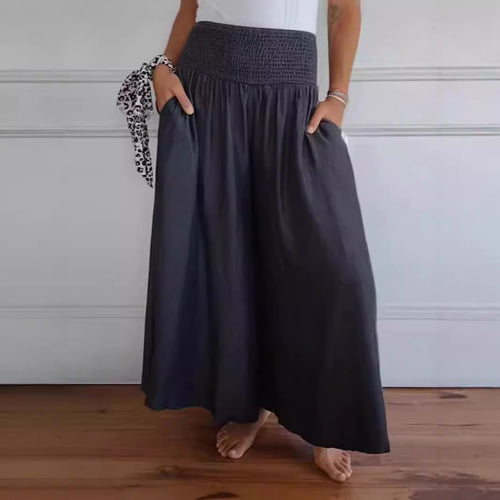 Damen-Maxi-Rock mit hohem Smockbund, weitem Fall und seitlichen Taschen Drune