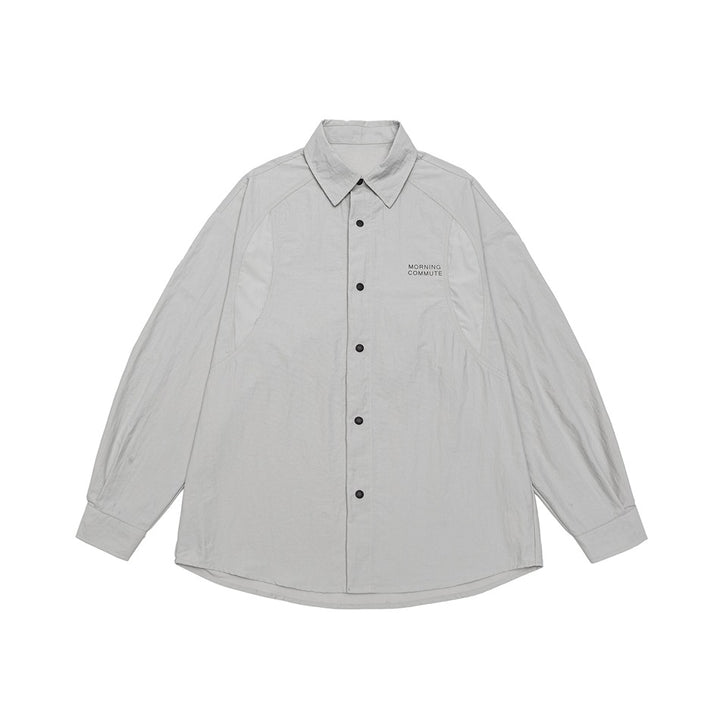 Unisex Lockeres Coach-Shirtjacke mit Kentkragen, Druckknopfleiste und minimalem Brustprint Drune