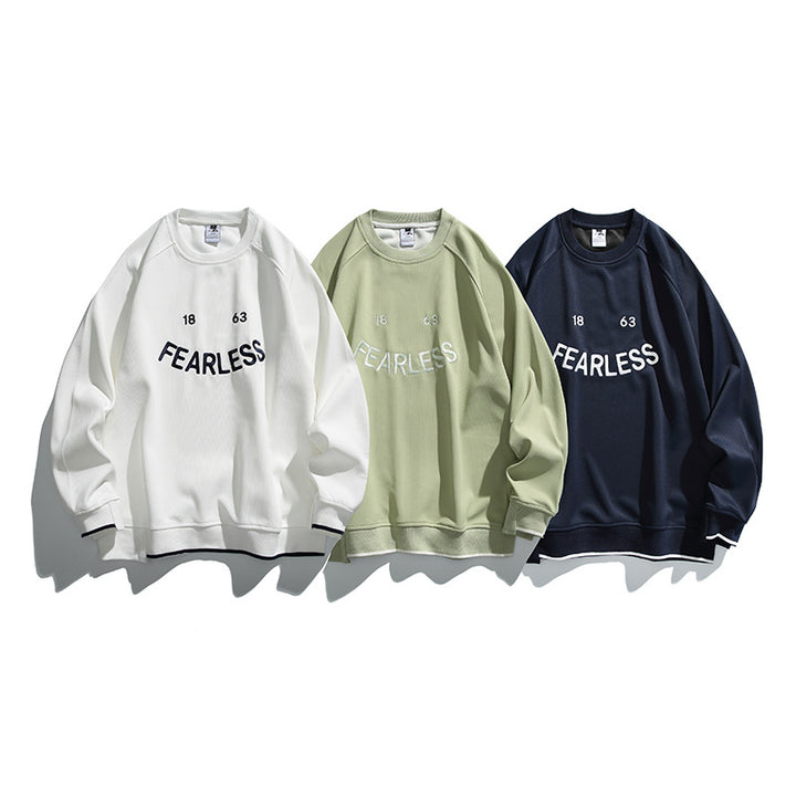 Unisex Oversize-Sweatshirt mit Raglanärmeln und markantem FEARLESS-Frontprint Drune