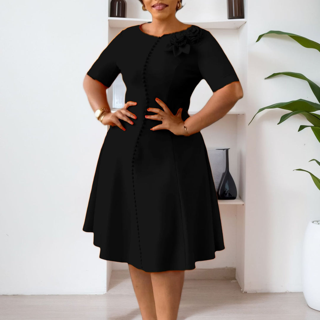Damen A-Linien Kleid mit eleganten Knopfdetails und floralem Accessoire Drune