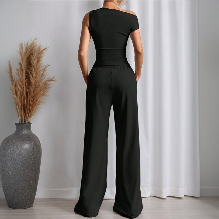 Damen stylischer Jumpsuit mit asymmetrischem Design und Taschen Drune