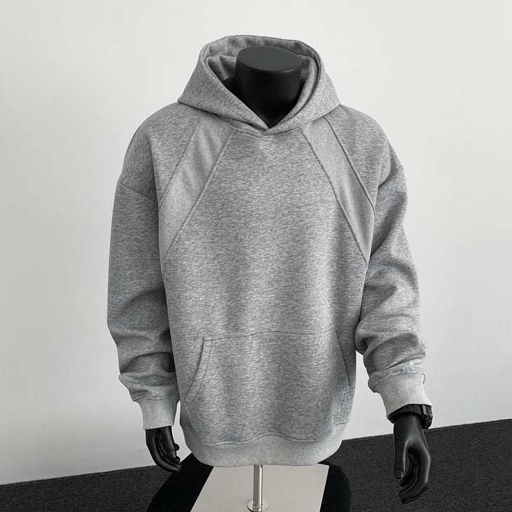 Herren Oversize-Kapuzenpullover mit diagonalem Einsatz und Kängurutasche Drune