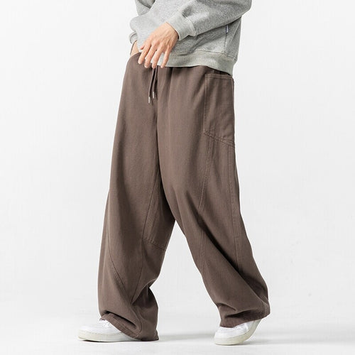 Herren Weite Loungehose mit Tunnelzug, aufgesetzten Taschen und markanten Panelnähten Drune
