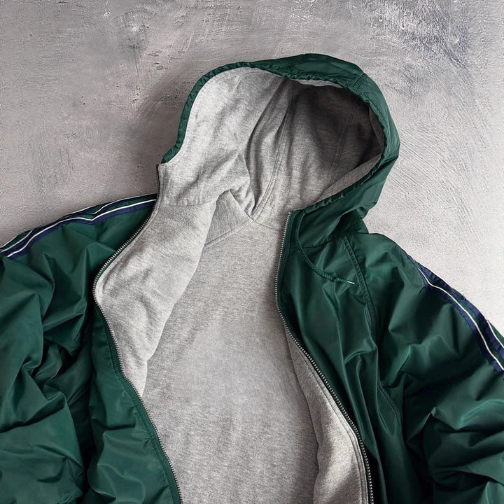 Unisex nan weit geschnittene Windjacke mit Kapuze wattiertem Fleeceinnenfutter Tunnelzugsaum und Zierstreifen an Ärmeln Drune