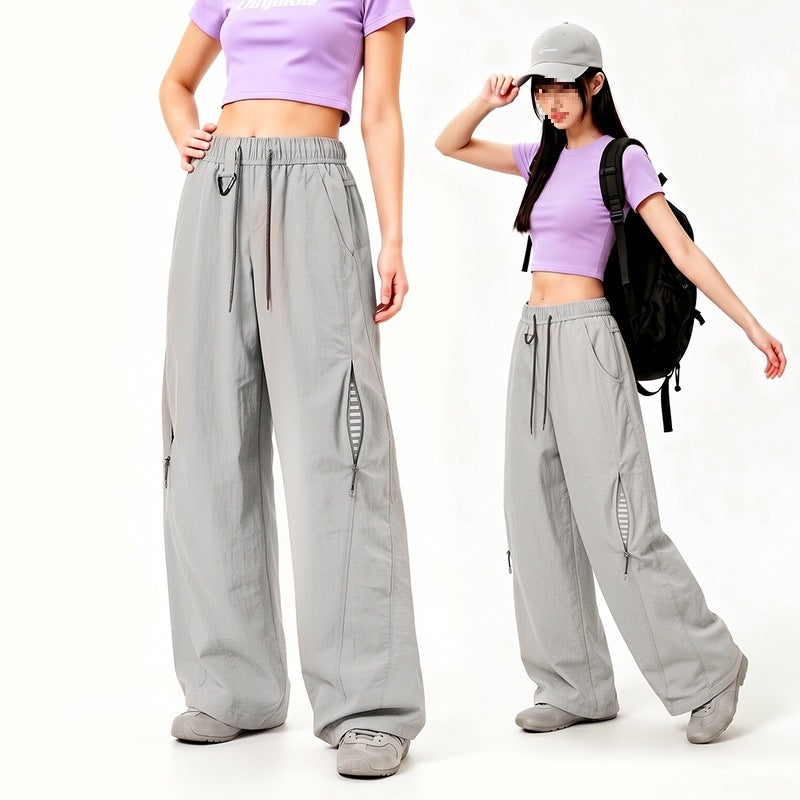 Damen Oversize Tech-Loungehose mit Kontrastnähten, reflektierenden Reißverschlusstaschen & Kordelbund Drune
