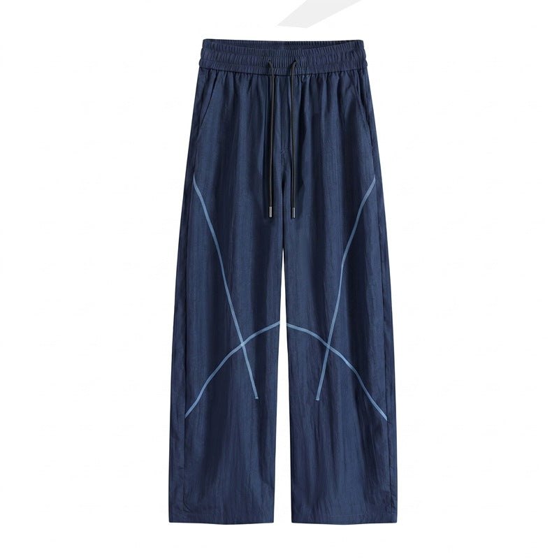 Herren Weite Funktions-Nylonhose mit Kordelbund, reflektierenden Nahtdetails & lässiger Baggy‑Silhouette Drune