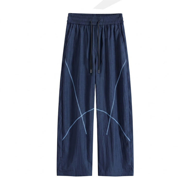 Herren Weite Funktions-Nylonhose mit Kordelbund, reflektierenden Nahtdetails & lässiger Baggy‑Silhouette Drune