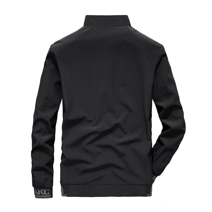 Herren Softshelljacke mit reflektierenden Einsätzen, wasserabweisenden Reißverschlusstaschen und hohem Stehkragen Drune