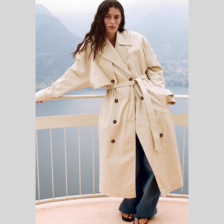 Damen Langer Trenchcoat mit doppelreihiger Knopfleiste, Taillengürtel und breitem Revers Drune