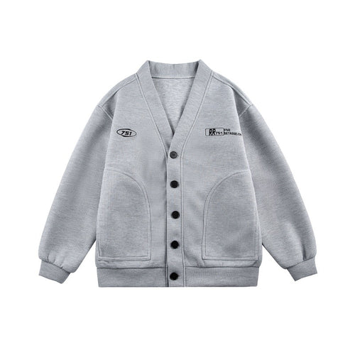 Unisex Boxy-Strickjacke im Waffelstrick mit V-Kragen, durchgehender Knopfleiste und aufgesetzten Rundtaschen Drune