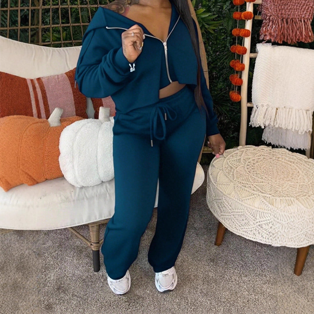 Damen sportliches Set aus cropped Kapuzenpullover und lässigen Jogginghosen mit Kordelzug