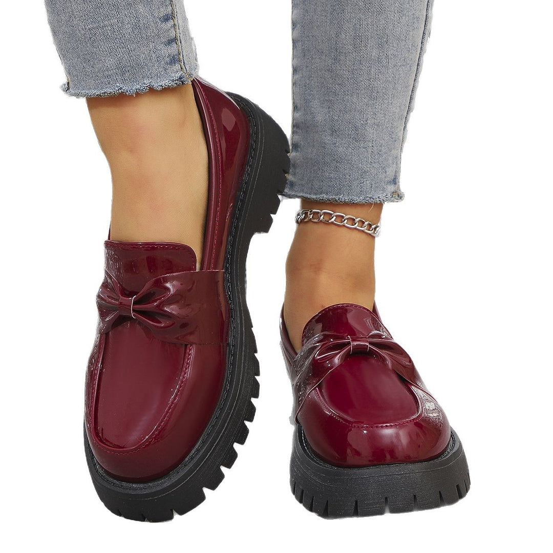 Damen  glänzende Plateau-Loafer mit übergroßer Schleifenapplikation und profilierter Gummisohle Drune