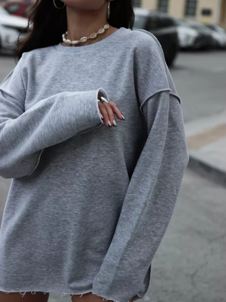 Damen oversized Sweatshirt mit ausgefranstem Saum und verlängerten Ärmeln Drune