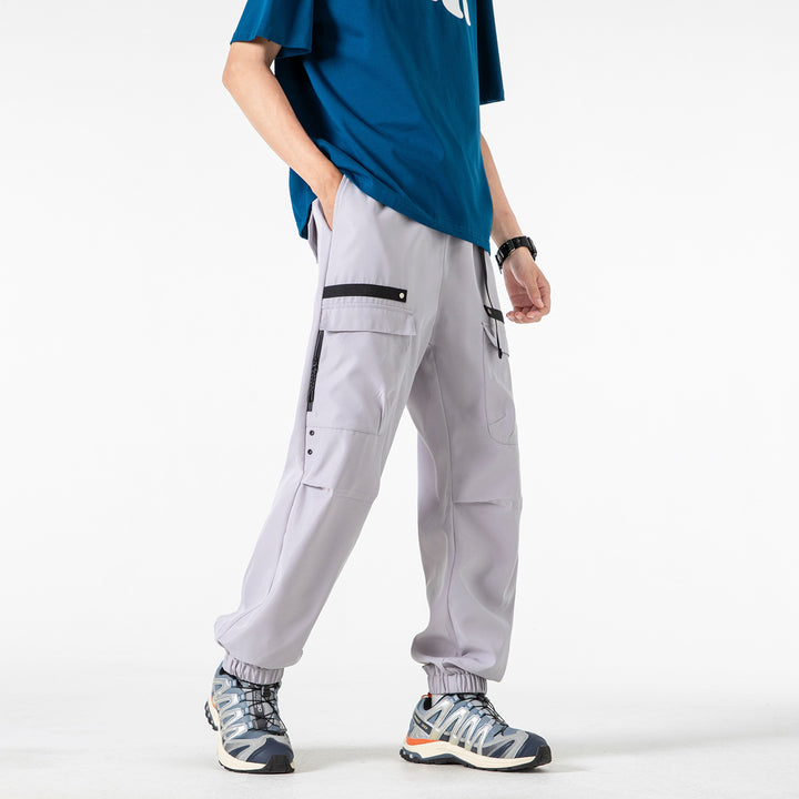 Herren weite Cargo-Jogginghose im Tech‑Utility‑Look mit elastischem Bund und multifunktionalen Klapptaschen Drune