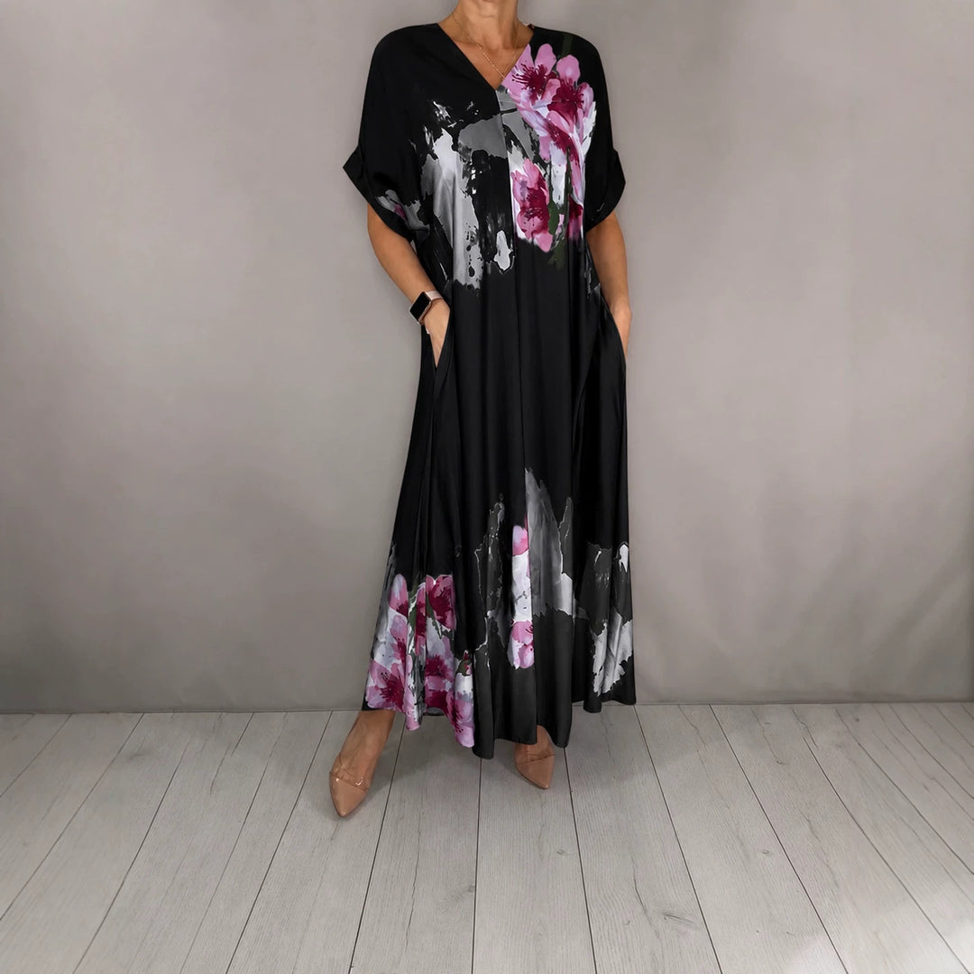Damen Maxikleid mit weitem Fall, V-Ausschnitt, Eingrifftaschen und floraler Aquarelloptik Drune