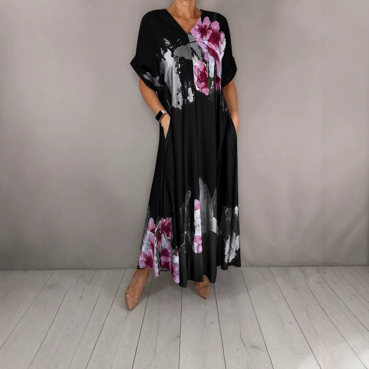 Damen Maxikleid mit weitem Fall, V-Ausschnitt, Eingrifftaschen und floraler Aquarelloptik Drune