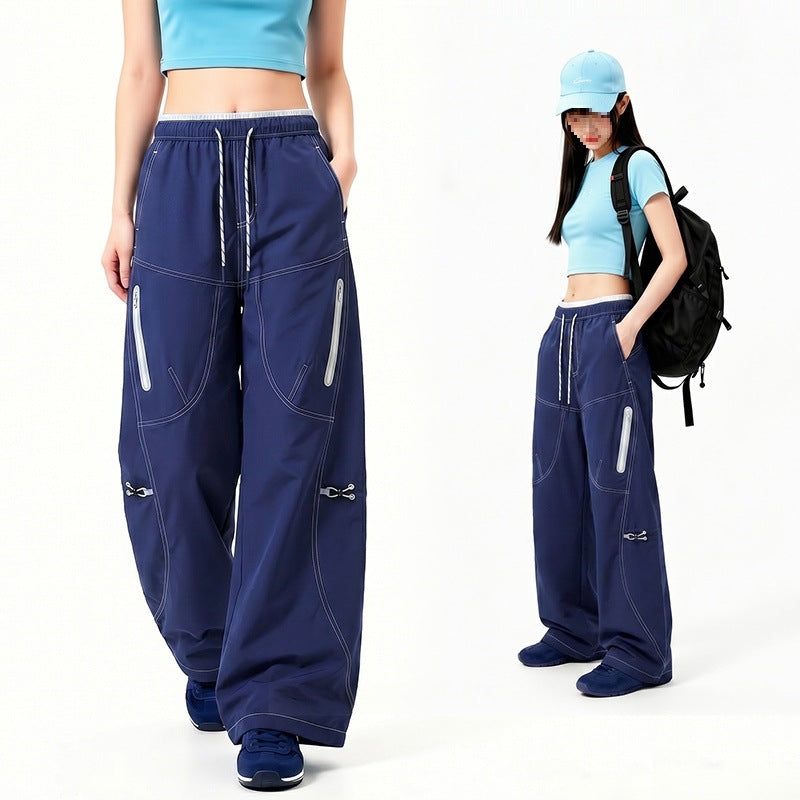 Damen Oversize Tech-Loungehose mit Kontrastnähten, reflektierenden Reißverschlusstaschen & Kordelbund Drune