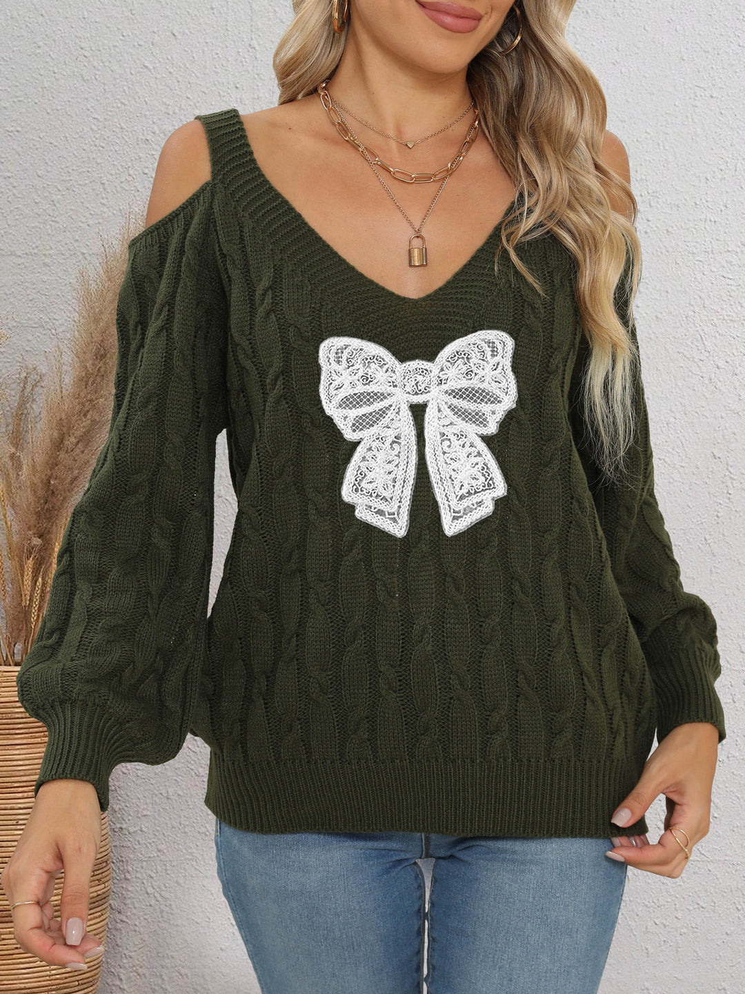 Damen modischer Pullover mit verspielt eingestricktem Schleifenmotiv Drune