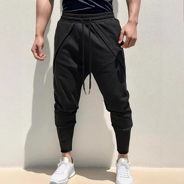 Herren Tapered-Jogginghose mit tiefem Schritt, elastischem Bund & diagonalgesetzten Taschen Drune