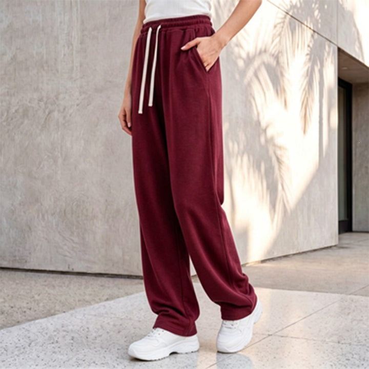 Damen nan weite Loungepalazzo-Hose mit hohem Komfortbund, Kordelzug, seitlichen Eingrifftaschen und dekorativer Seitennaht Drune