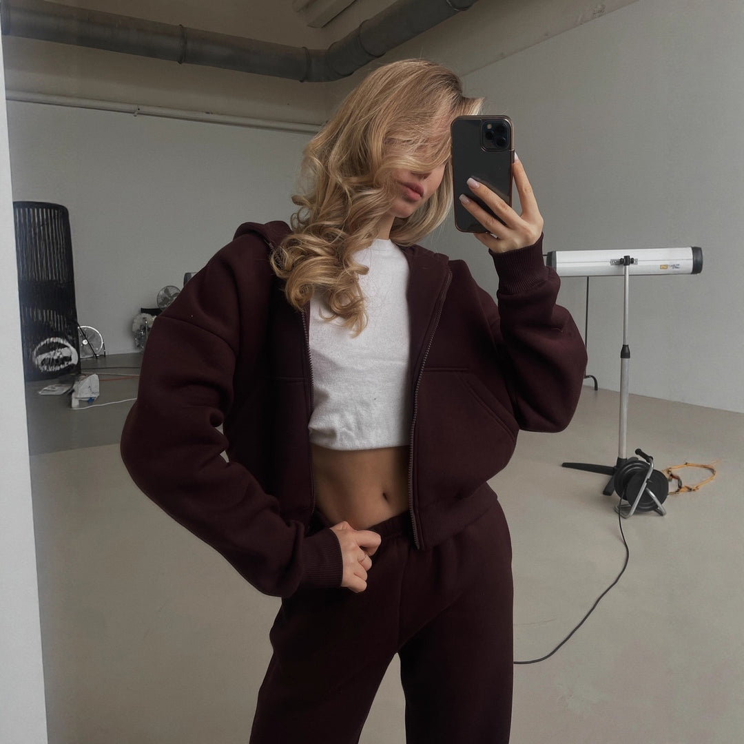 Damen Cropped Kapuzen-Sweatjacke mit Kängurutasche und tailliertem Rippbund Drune