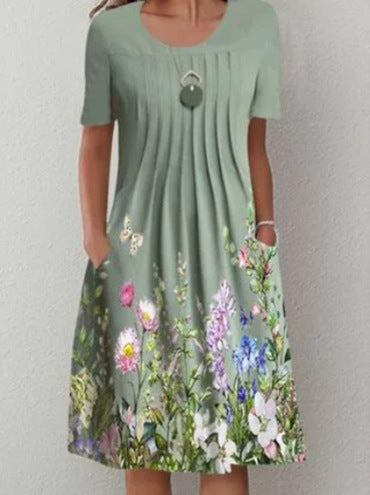 Damen Plissee Midi Kleid mit kurzen Ärmeln, seitlichen Taschen und floralem Saum Drune