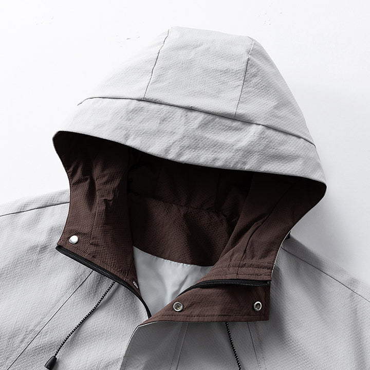 Unisex leichte winddichte Outdoorjacke mit Kapuze, wasserabweisender Außenhülle und verstellbarem Saum Drune