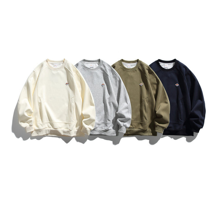 Unisex Oversize-Sweatshirt aus French-Terry mit Raglanärmeln, verdeckten Eingrifftaschen und kleinem Logopatch Drune