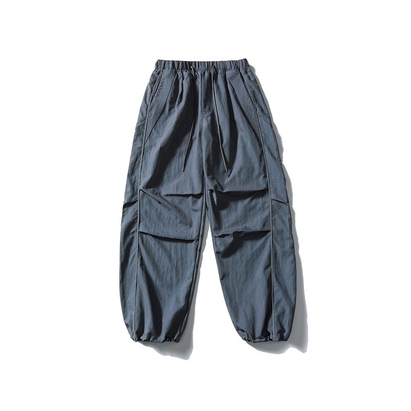 [Herren] weit geschnittene Nylon-Joggerhose im Utility-Stil mit Tunnelzugbund, Kontrastpaspel und elastischen Knöchelabschlüssen Drune