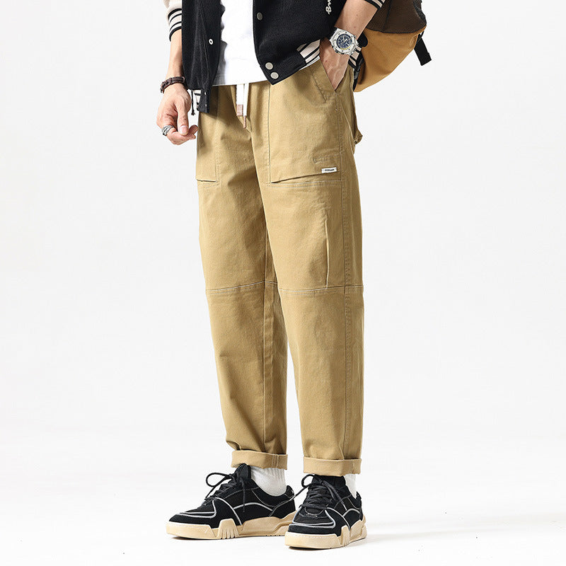 Herren Baggy-Utility-Cargohose im Tapered-Schnitt mit elastischem Tunnelzugbund, aufgesetzten Fronttaschen und Knieabnähern Drune