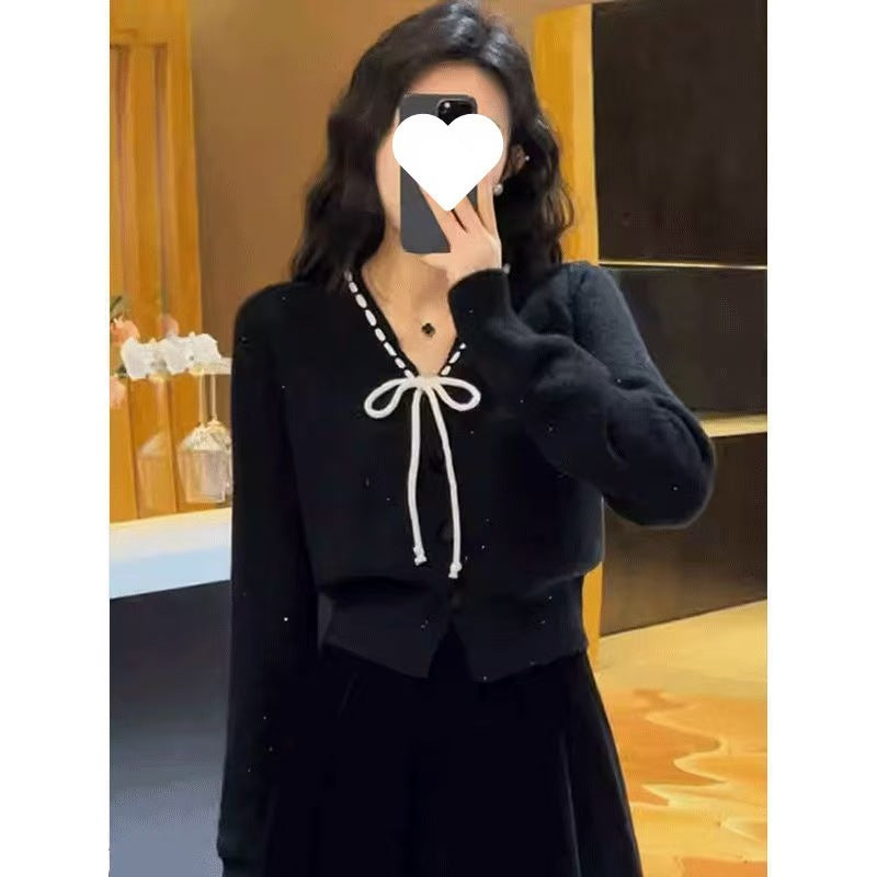 Damen Strickjacke mit dekorativem Schleifenverschluss und Knopfdetails Drune