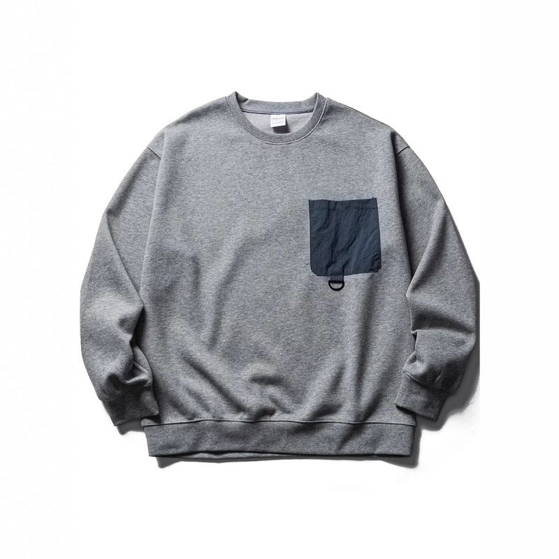 Unisex Oversize-Sweatshirt mit kontrastierender Brusttasche und D-Ring Drune
