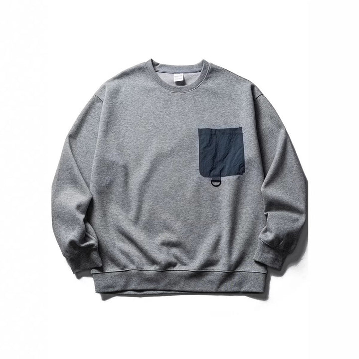 Unisex Oversize-Sweatshirt mit kontrastierender Brusttasche und D-Ring Drune