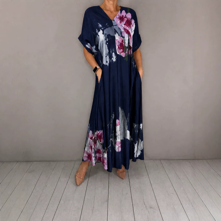 Damen Maxikleid mit weitem Fall, V-Ausschnitt, Eingrifftaschen und floraler Aquarelloptik Drune