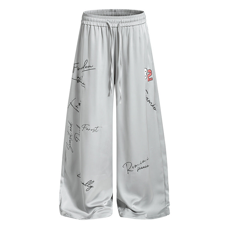 Damen Weite Satin-Palazzo-Loungehose mit Elastikbund, Kordelzug und Script-Print Drune