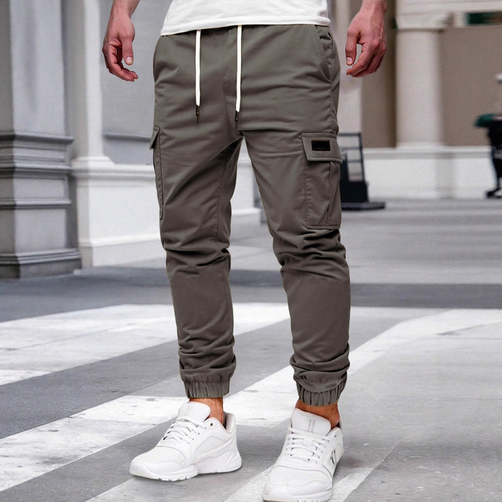 Herren nan tapered Freizeit-Cargohose mit aufgesetzten Klapptaschen, Tunnelzugbund und elastischen Beinabschlüssen Drune