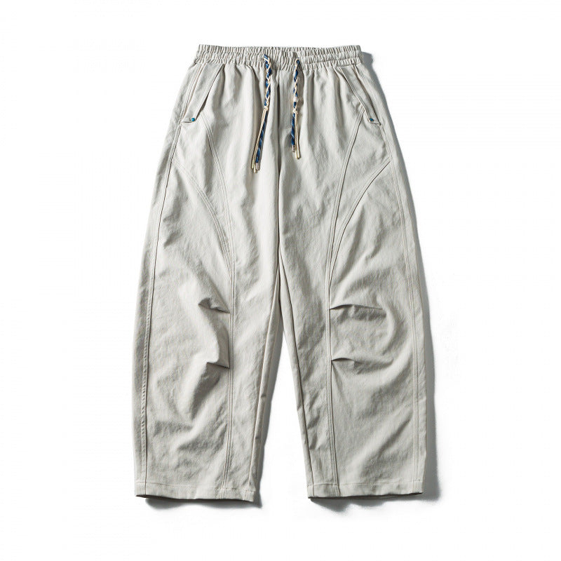 Unisex Weite Cropped-Hose mit Tunnelzug, elastischem Bund und markanten Nahtpaneelen Drune