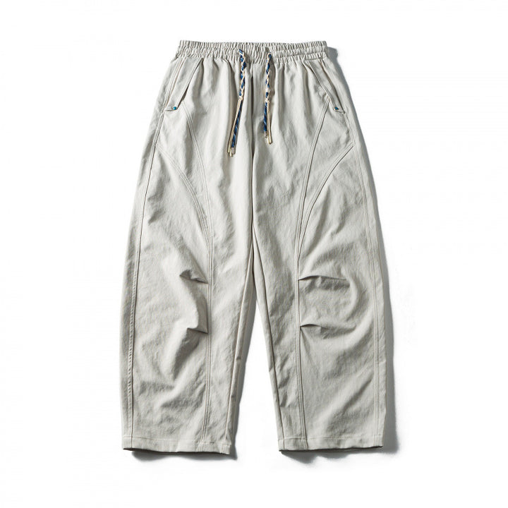 Unisex Weite Cropped-Hose mit Tunnelzug, elastischem Bund und markanten Nahtpaneelen Drune