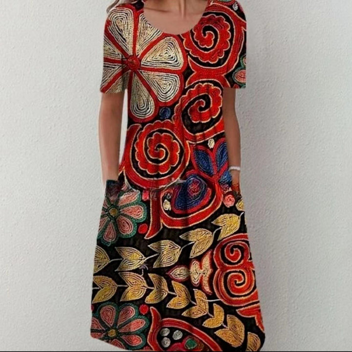 Damen Plissee Midi Kleid mit kurzen Ärmeln, seitlichen Taschen und floralem Saum Drune